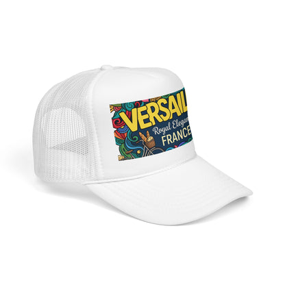 White trucker hat with front panel and “VERSAILLES” France graphic patch.
