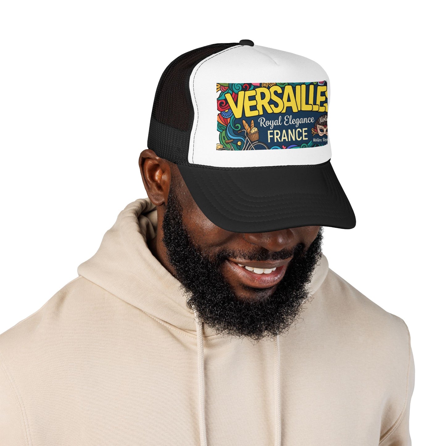 Black and white trucker cap with mesh panels and “Versailles” graphic patch on front