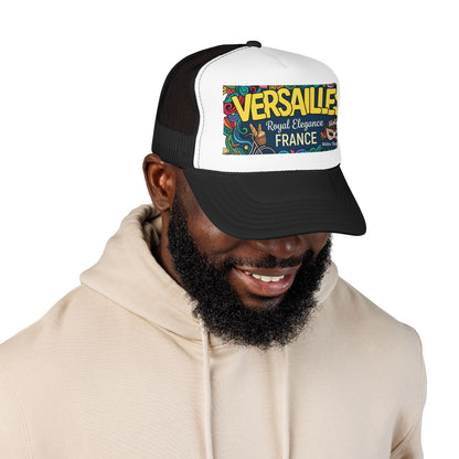 Black and white trucker cap with mesh panels and “Versailles” graphic patch on front