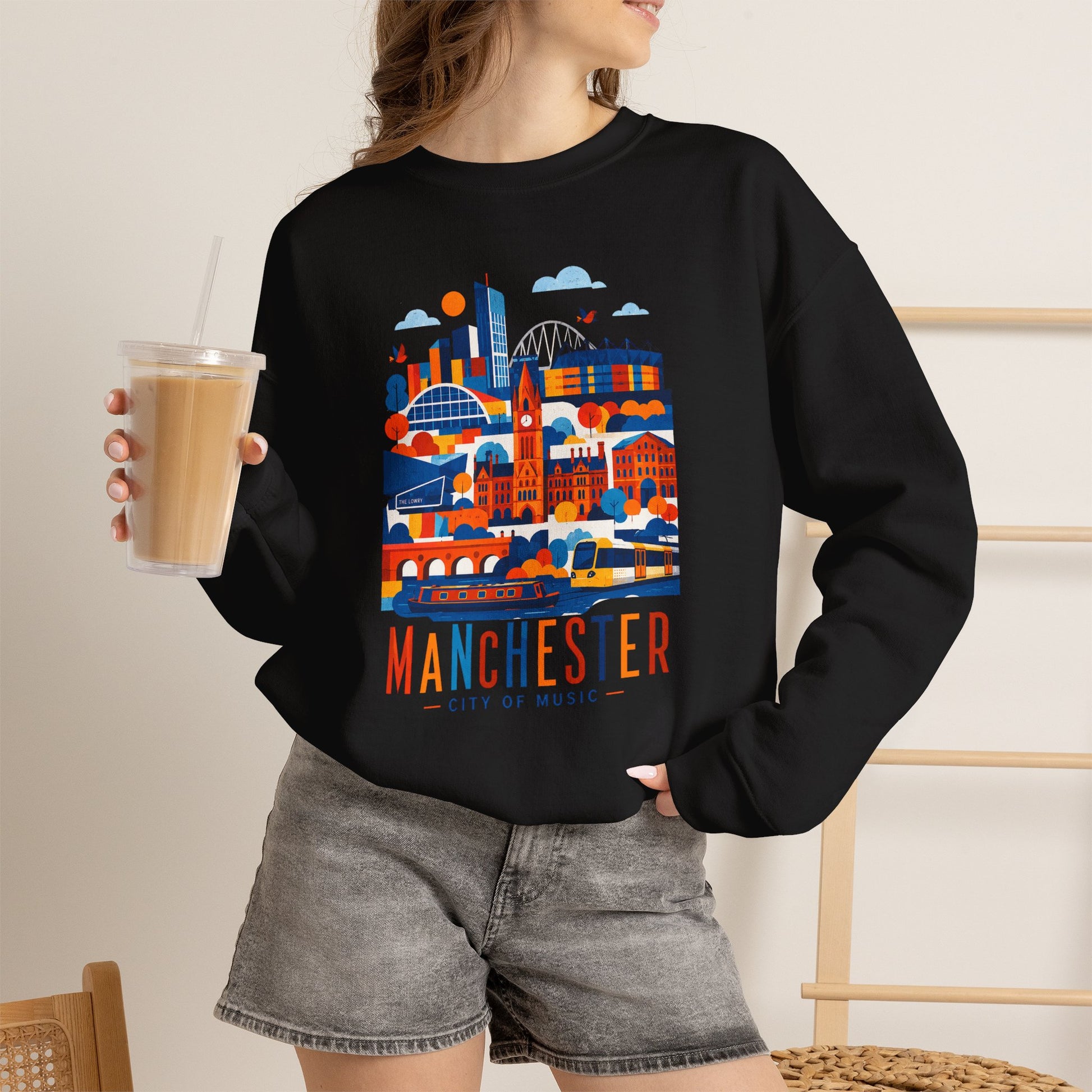 Manchester cityscape crewneck sweatshirt, black, front graphic with Manchester lettering