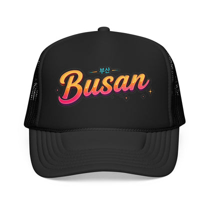 Black trucker hat with front Busan logo and black mesh side panels