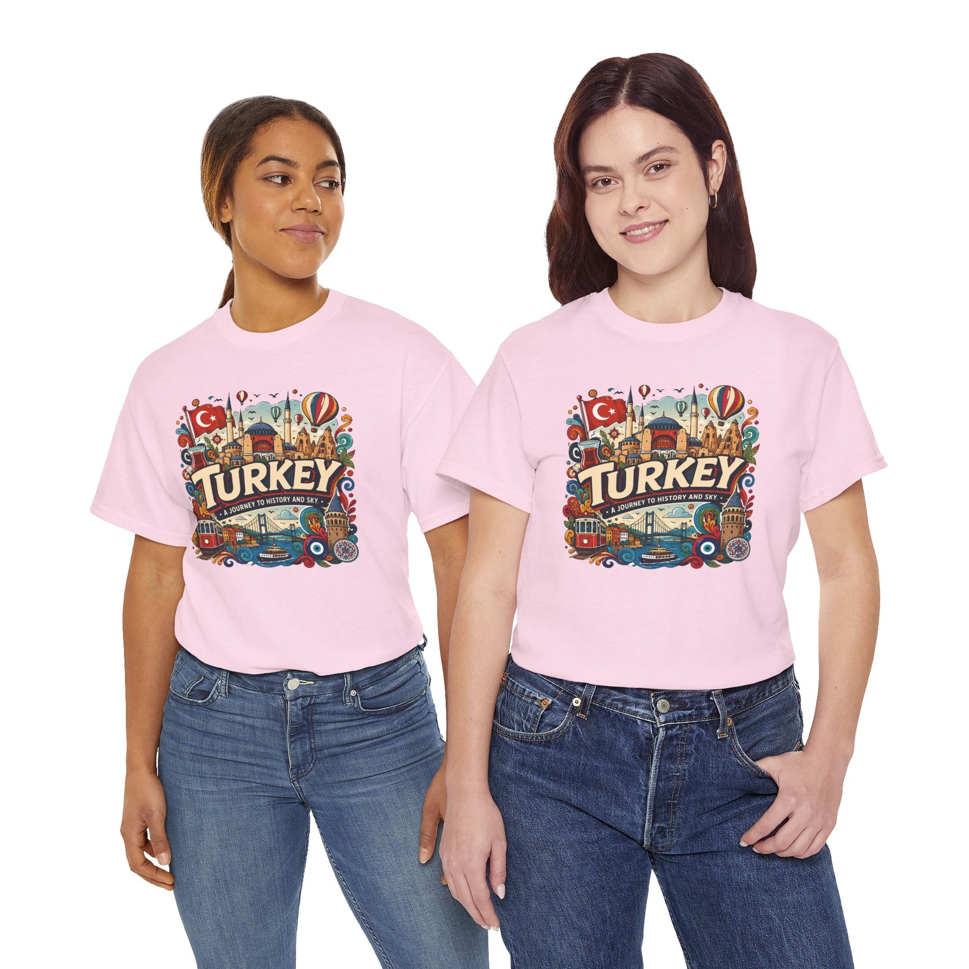 Light pink graphic tee with colorful Turkey-themed front emblem, paired with jeans
