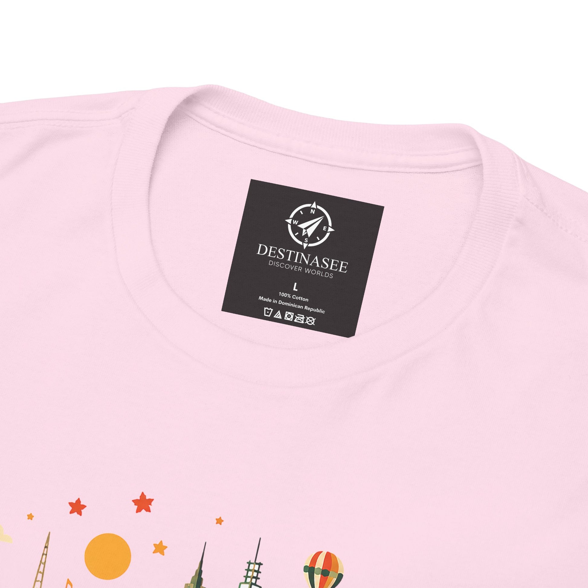 Light pink T-shirt with crew neck and small black neck label; top of Melbourne graphic visible.
