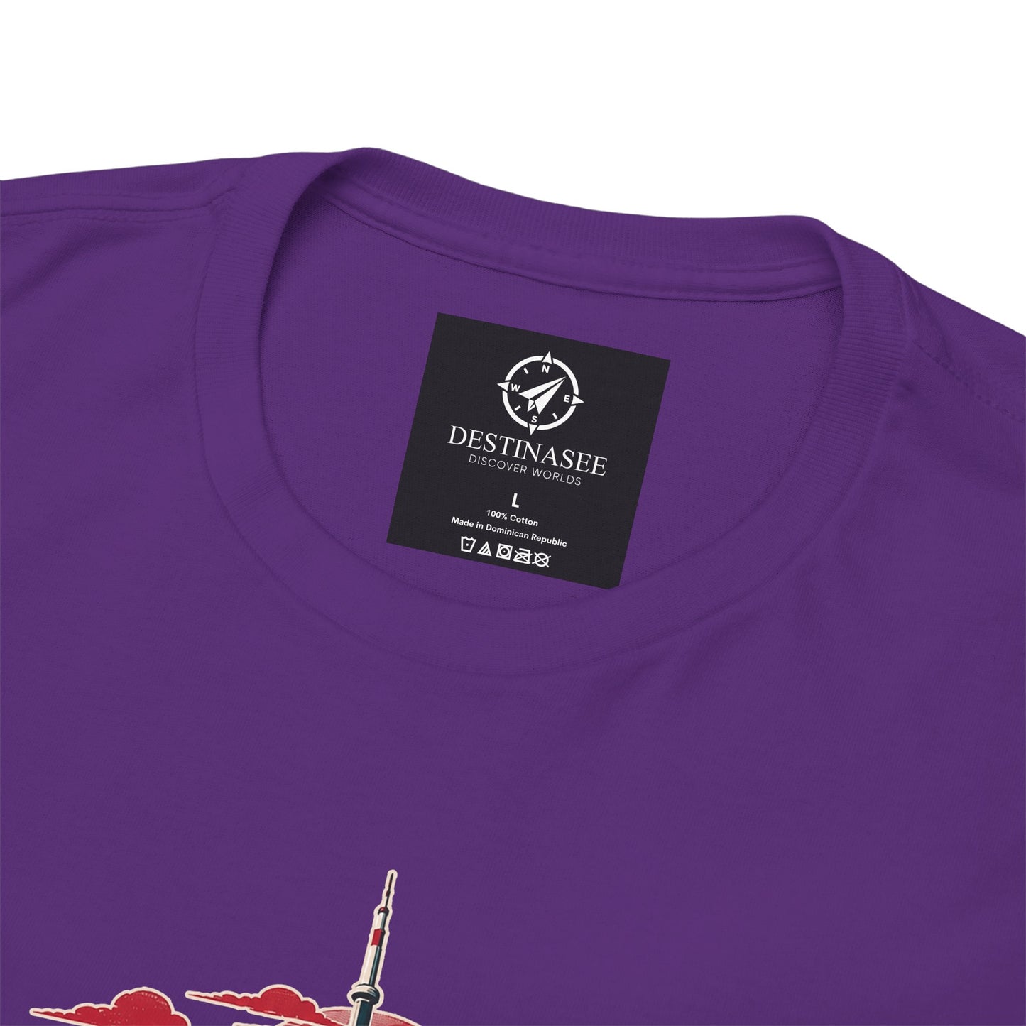 Purple T-shirt back with small square brand logo at neckline and partial skyline graphic.