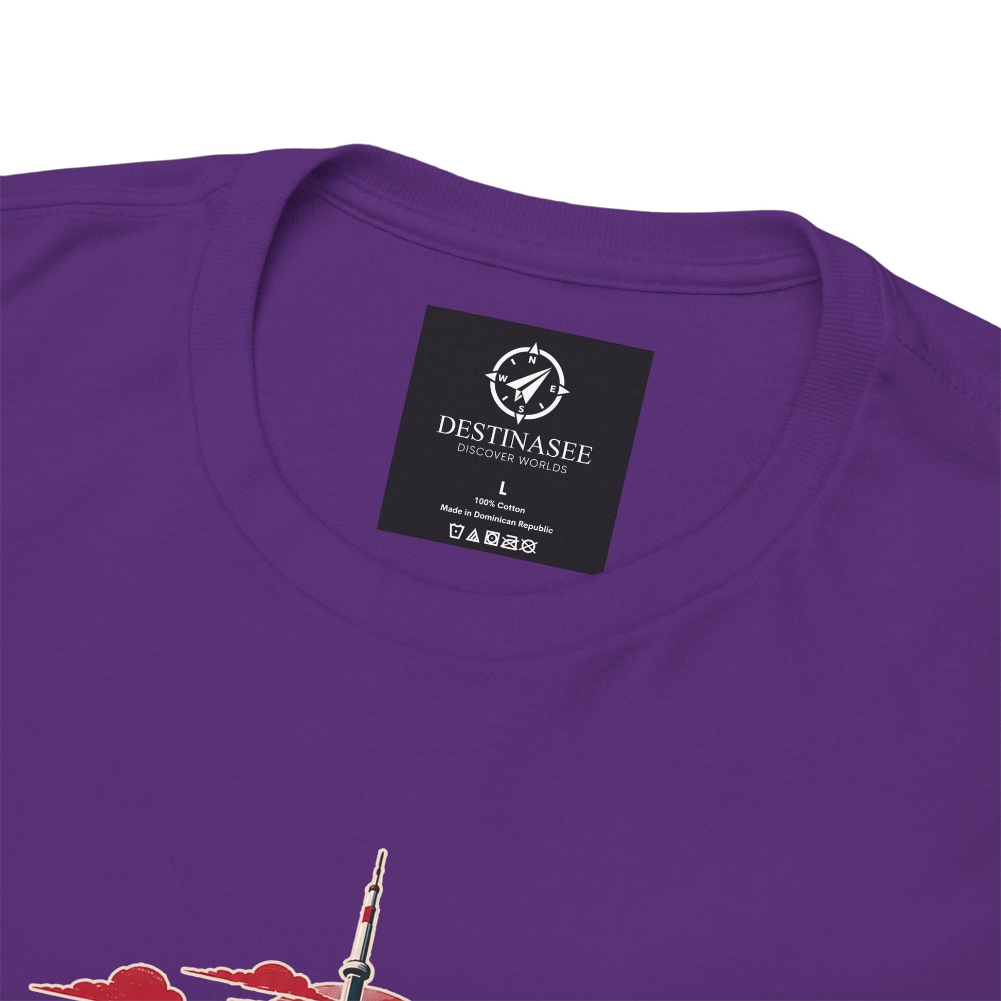 Purple T-shirt back with small square brand logo at neckline and partial skyline graphic.
