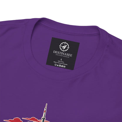 Purple T-shirt back with small square brand logo at neckline and partial skyline graphic.