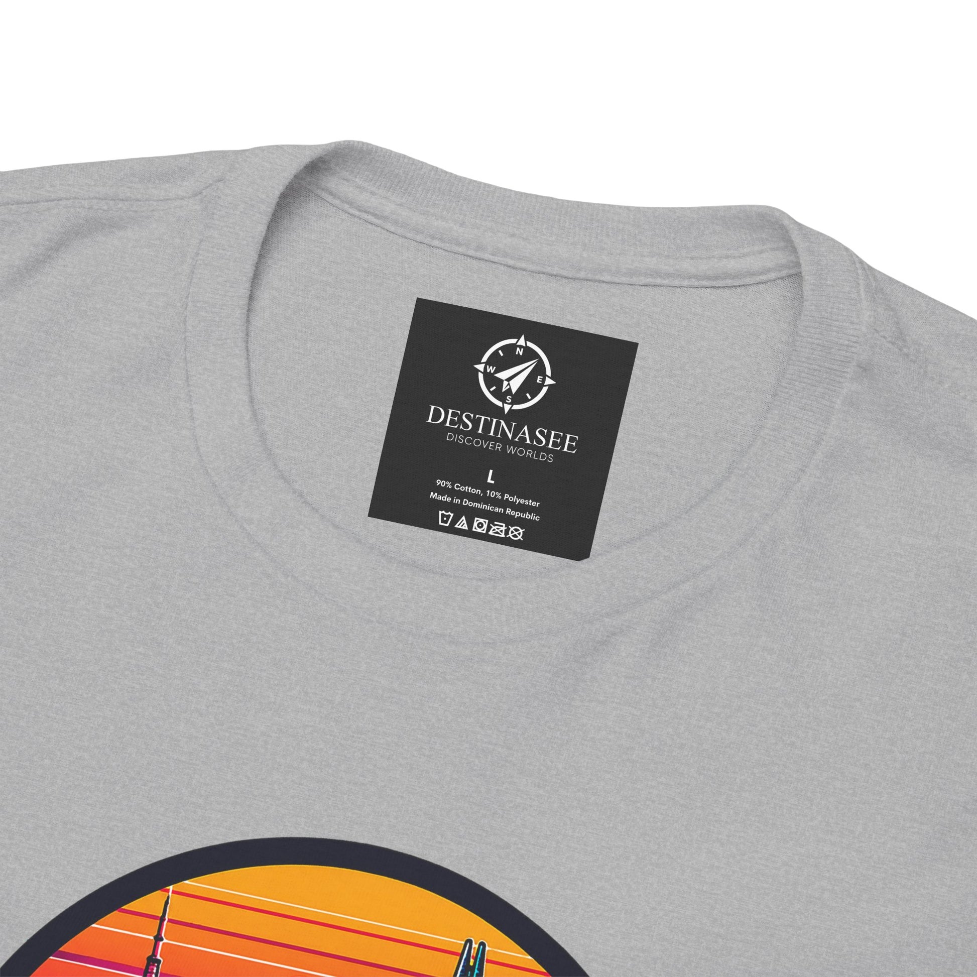 Charcoal gray T-shirt with small neck label and partial colorful chest graphic