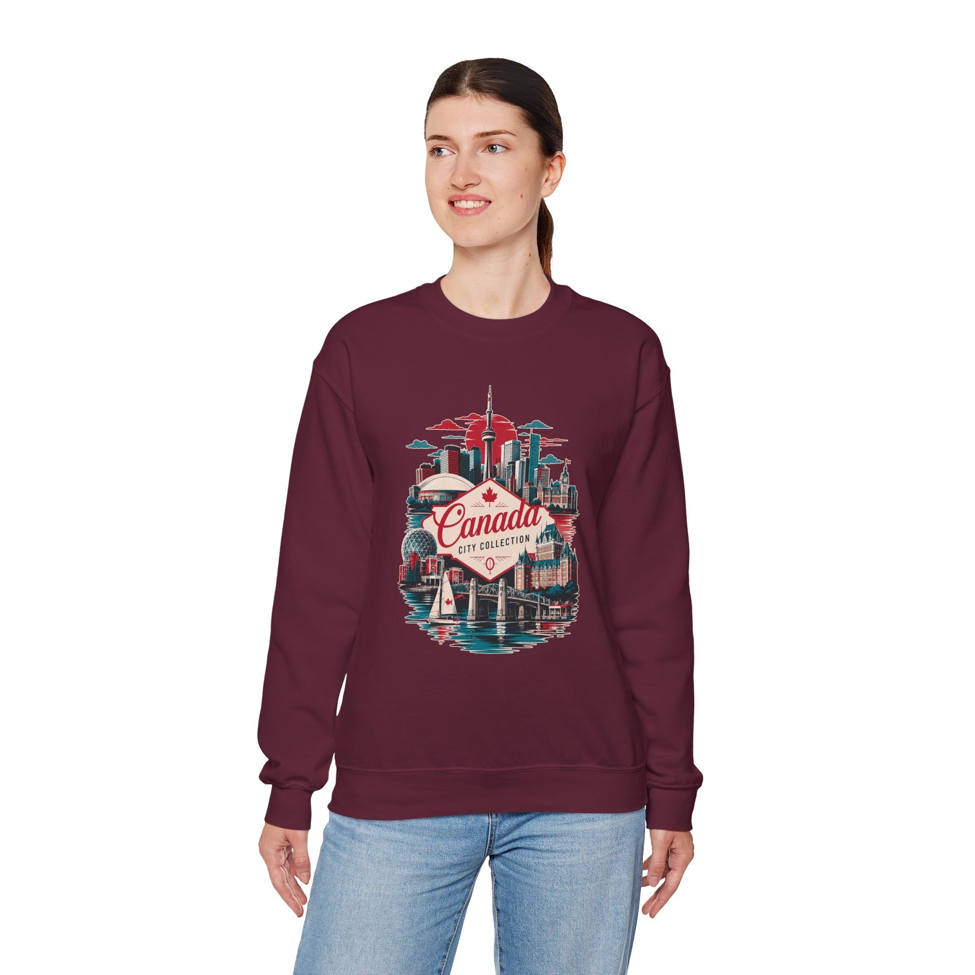 Maroon crewneck sweatshirt with multicolor Toronto Canada graphic on front.