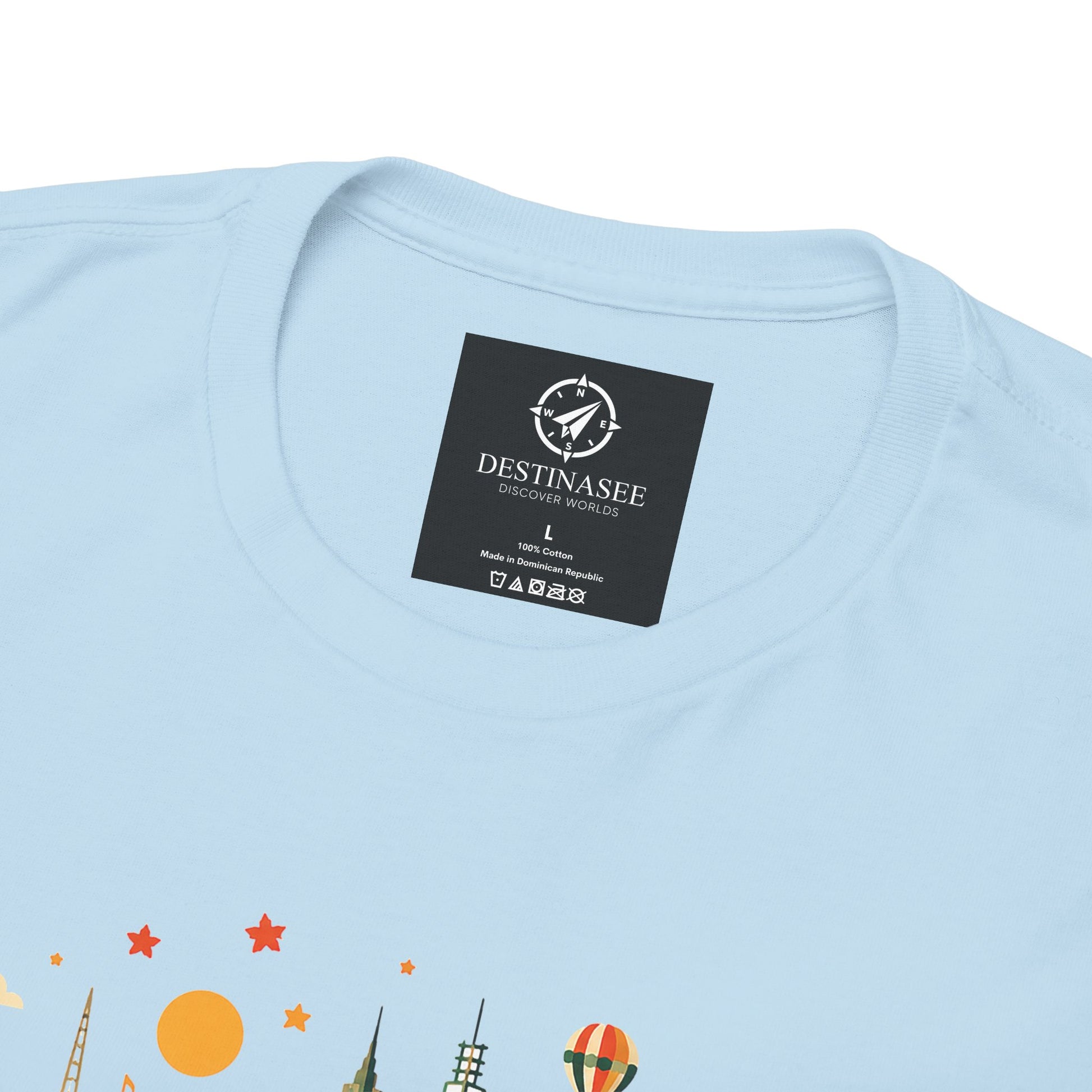 Light blue T-shirt with colorful Melbourne skyline graphic and black neck label patch