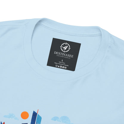 Light blue Manchester Skyline T-shirt with black brand label near the collar.
