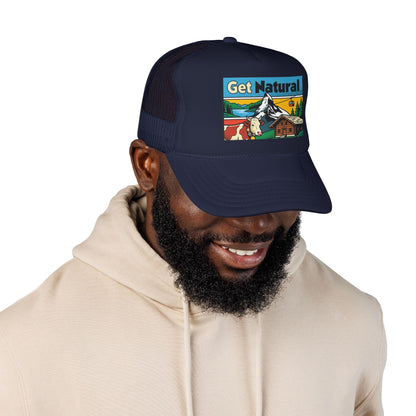 Dark navy trucker hat with Get Natural logo patch on wearer