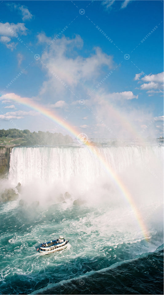 Niagara Falls mobile wallpaper with misty waterfall and a visible rainbow arc