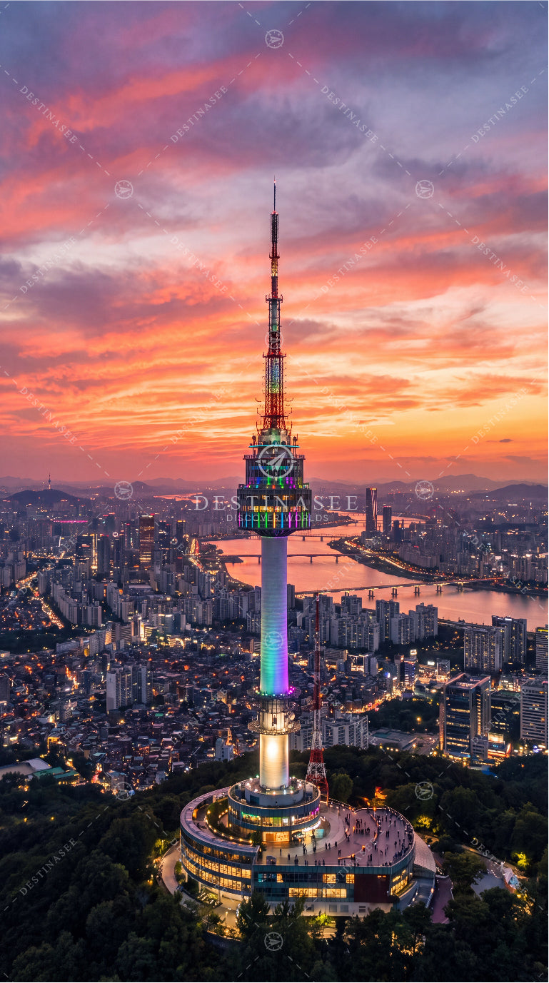 Seoul Tower mobile wallpaper with illuminated tower at sunset over city skyline